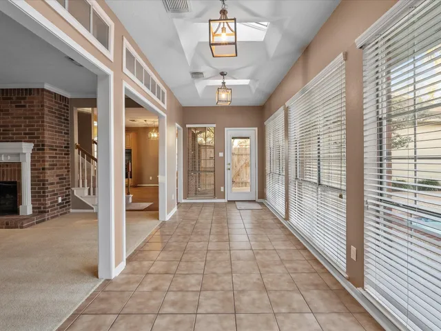 a view of a hallway with windows