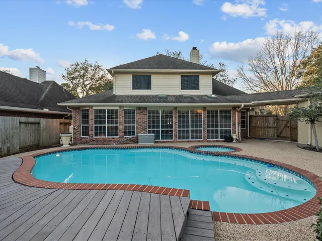 a view of pool with outdoor seating