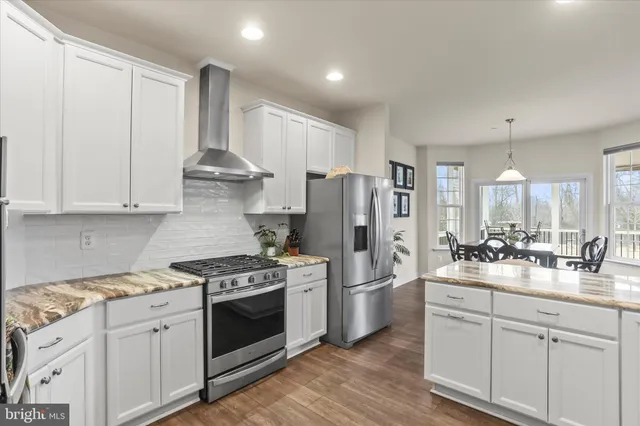 a kitchen with a stove and a cabinet