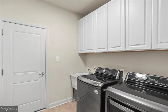 an empty room with wooden floor & closet area
