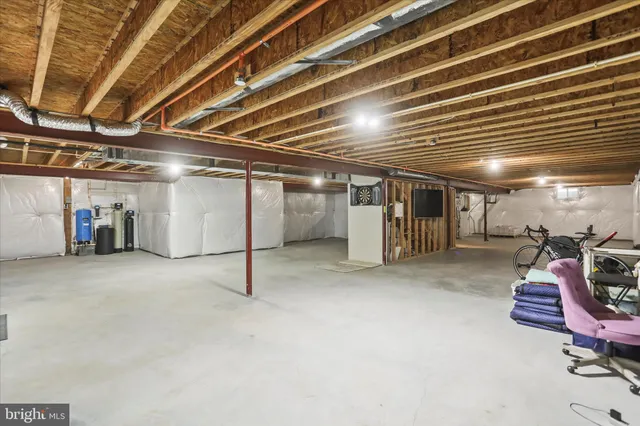 a bathroom with a shower sink and mirror