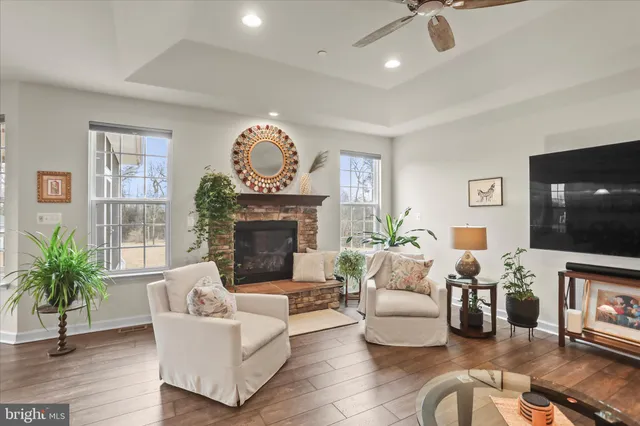 a living room with furniture and a fireplace