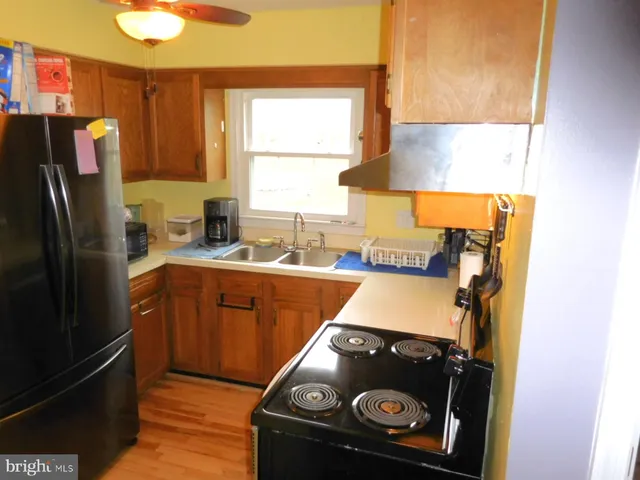 a kitchen with a stove and a refrigerator