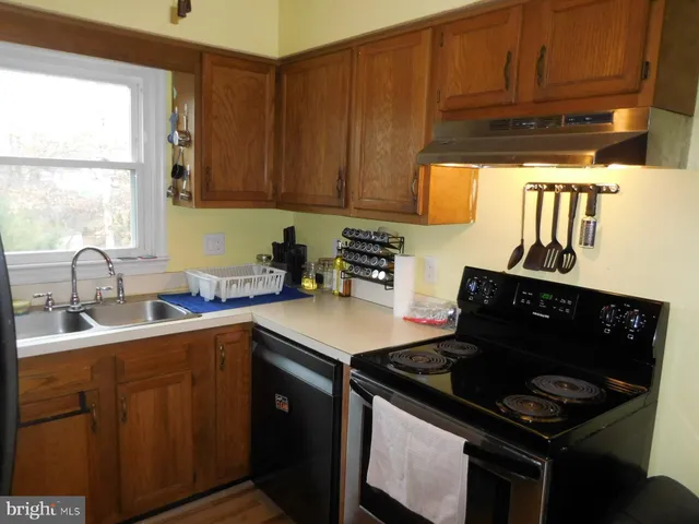 a kitchen with a stove and a sink