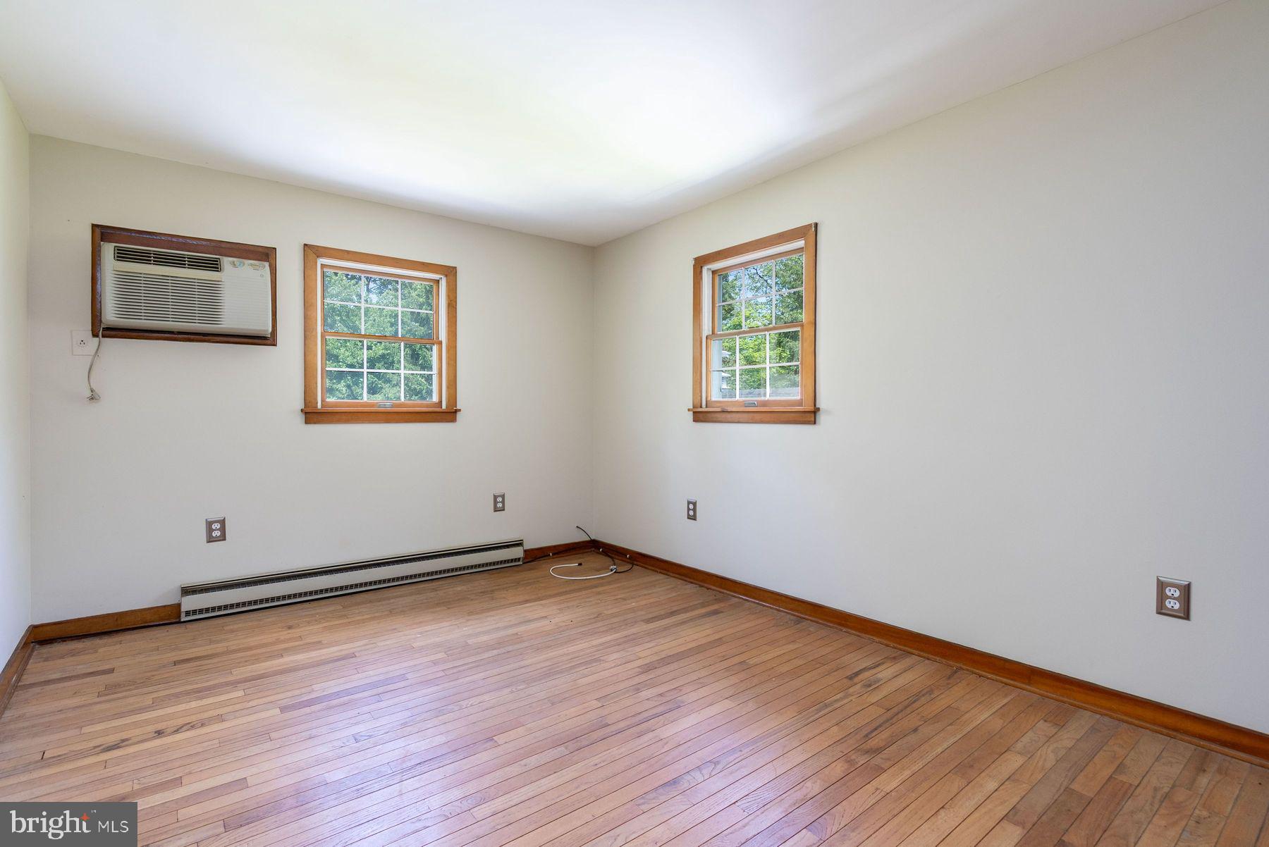 2349 Valley Road Jamison, PA 18929 - Photo 46 of 53 a view of an empty room with wooden floor and a window