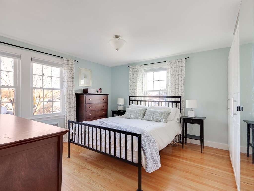 2 Central Terrace Needham, MA 02494 - Photo 16 of 33 a bedroom with a bed and wooden floor