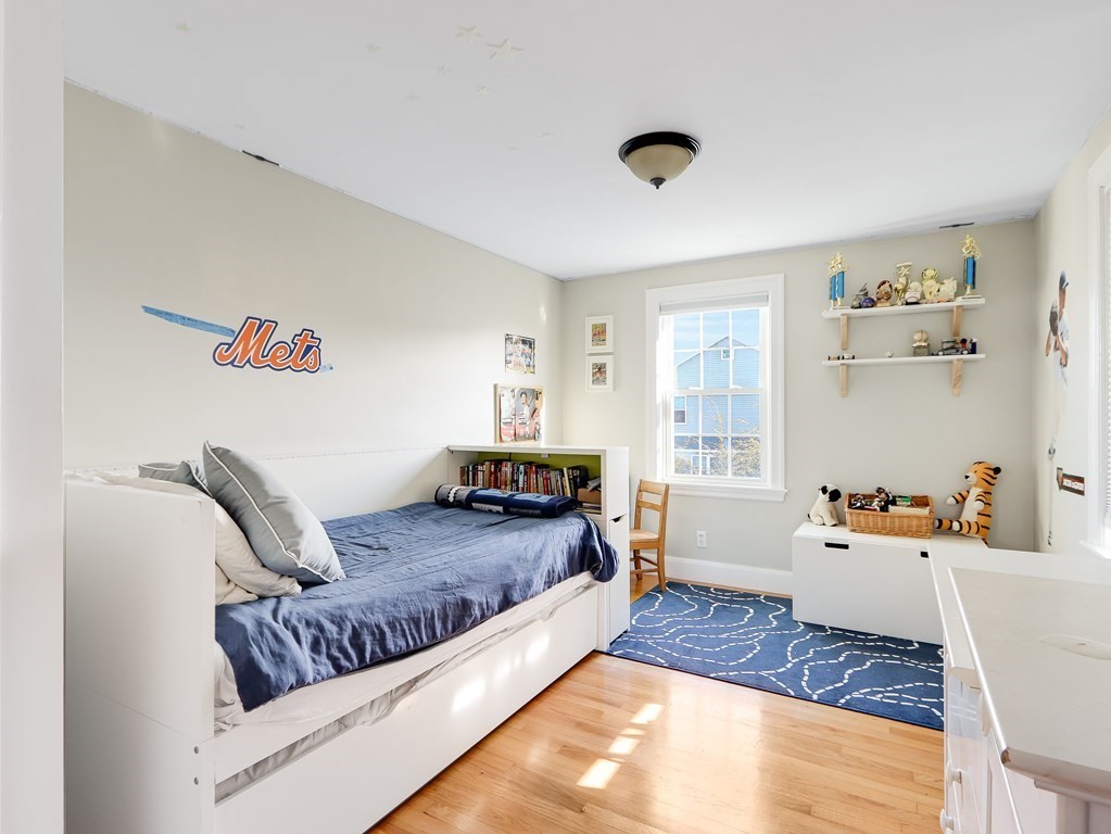 2 Central Terrace Needham, MA 02494 - Photo 19 of 33 a bedroom with a bed and a couch