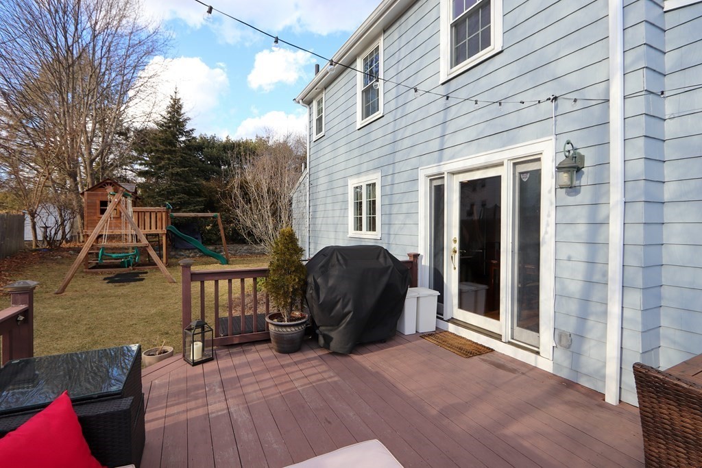 2 Central Terrace Needham, MA 02494 - Photo 24 of 33 a view of a patio with a table and chairs and wooden fence