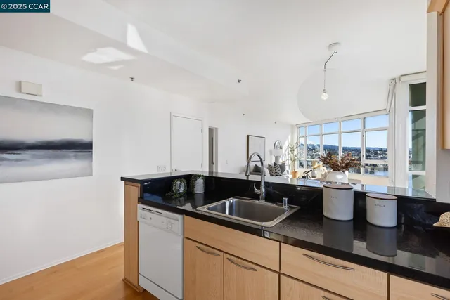 a kitchen with a sink and cabinets