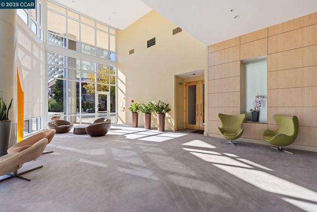 a view of a lobby with furniture and floor to ceiling window