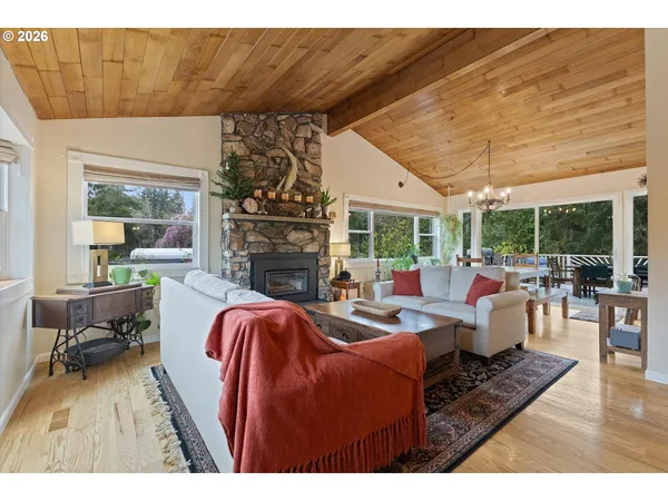 a living room with furniture a fireplace and a table