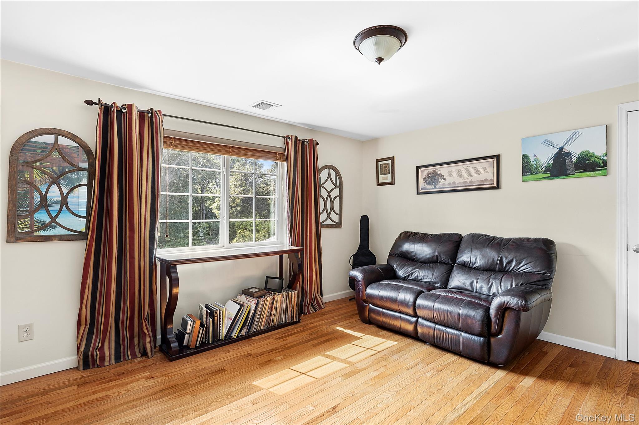 46 South Howell Avenue Centereach, NY 11720 - Photo 12 of 19 a living room with furniture and a window
