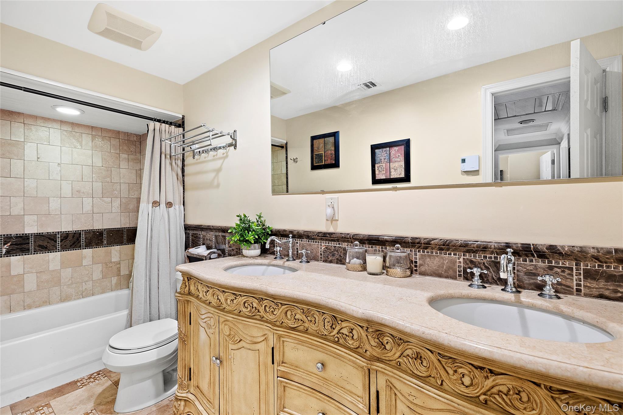 46 South Howell Avenue Centereach, NY 11720 - Photo 13 of 19 a bathroom with a sink toilet and shower