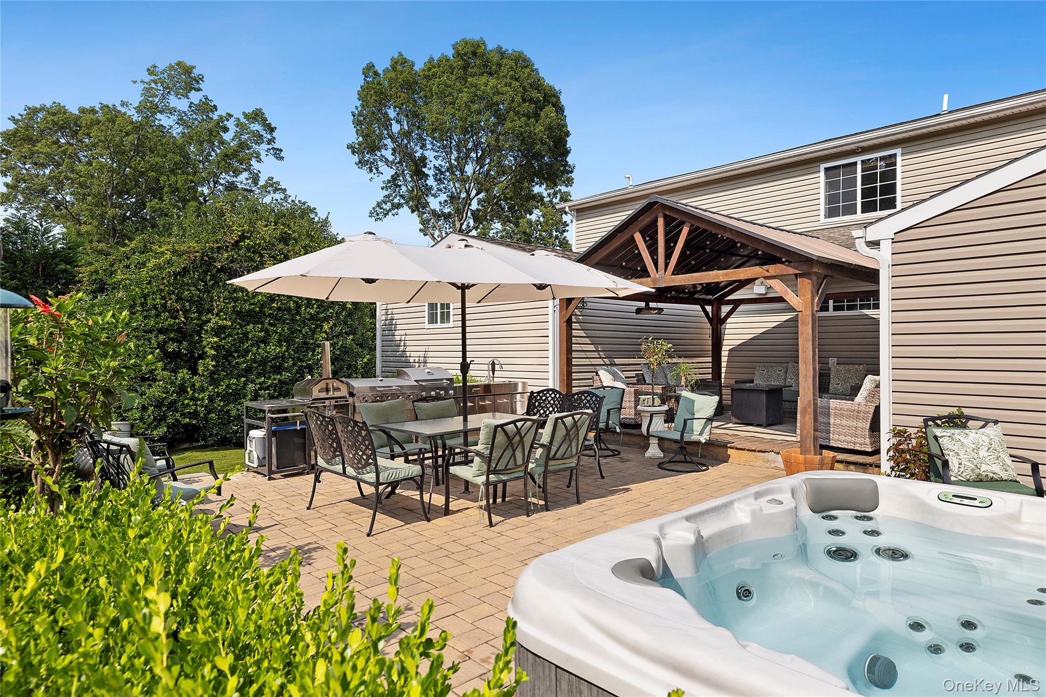 46 South Howell Avenue Centereach, NY 11720 - Photo 15 of 19 a swimming pool with outdoor seating and yard in the back