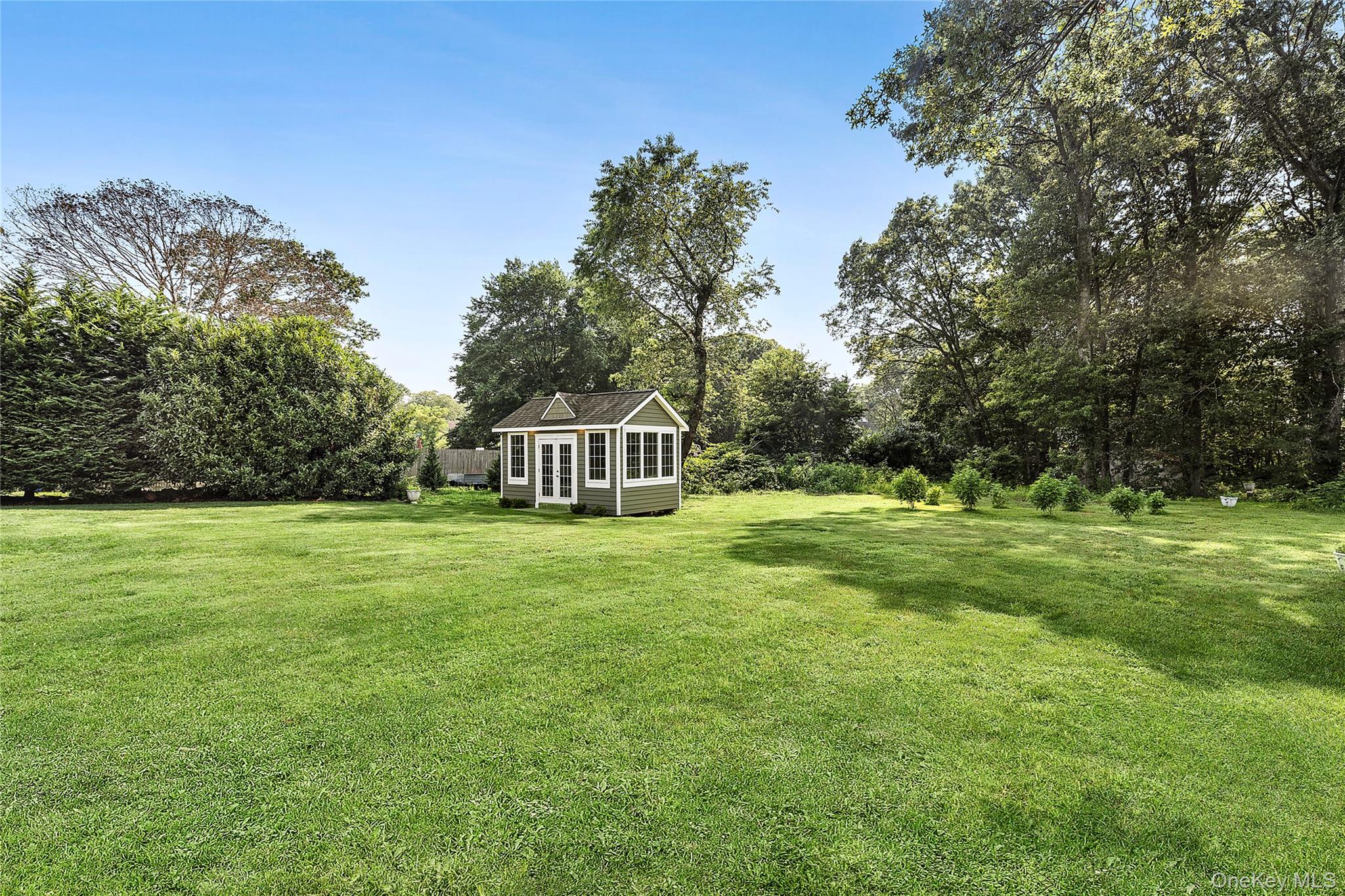 46 South Howell Avenue Centereach, NY 11720 - Photo 16 of 19 a view of a house with a yard