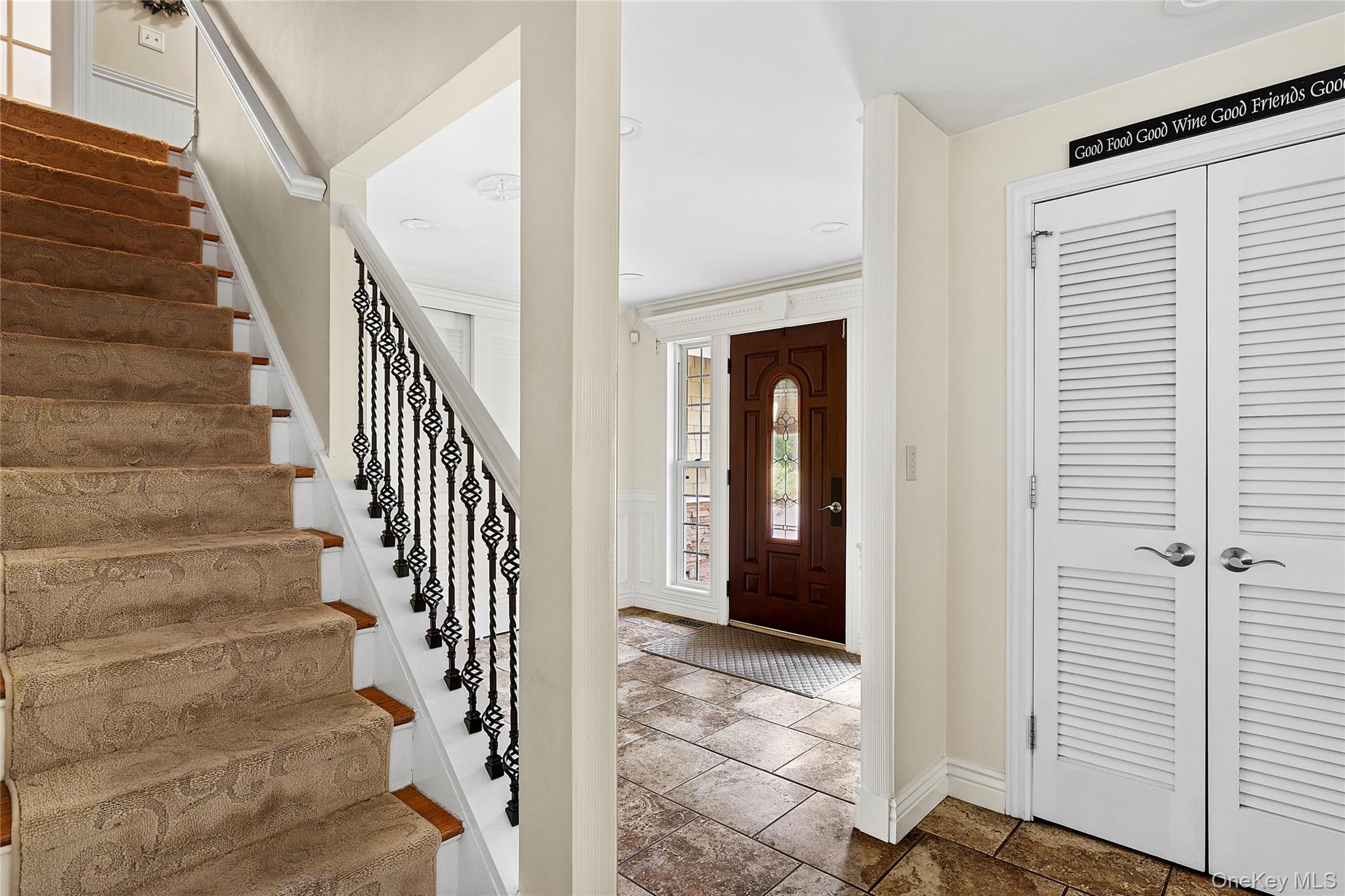 46 South Howell Avenue Centereach, NY 11720 - Photo 6 of 19 a view of entryway with wooden floor and windows