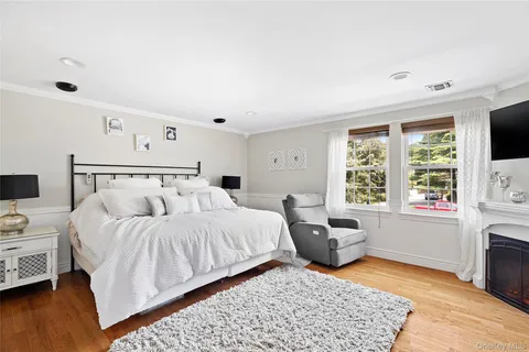 a bathroom with a granite countertop toilet sink and mirror