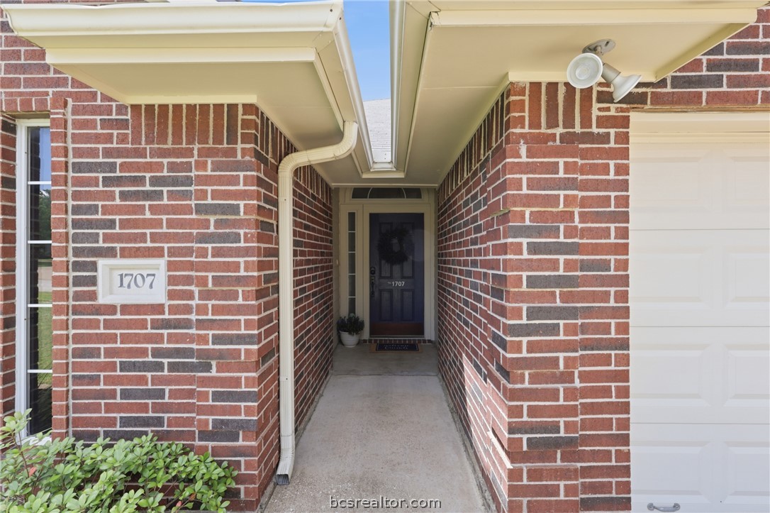 1707 Beaver Pond Court Bryan, TX 77807 - Photo 4 of 33 Brick exterior with an inset entryway