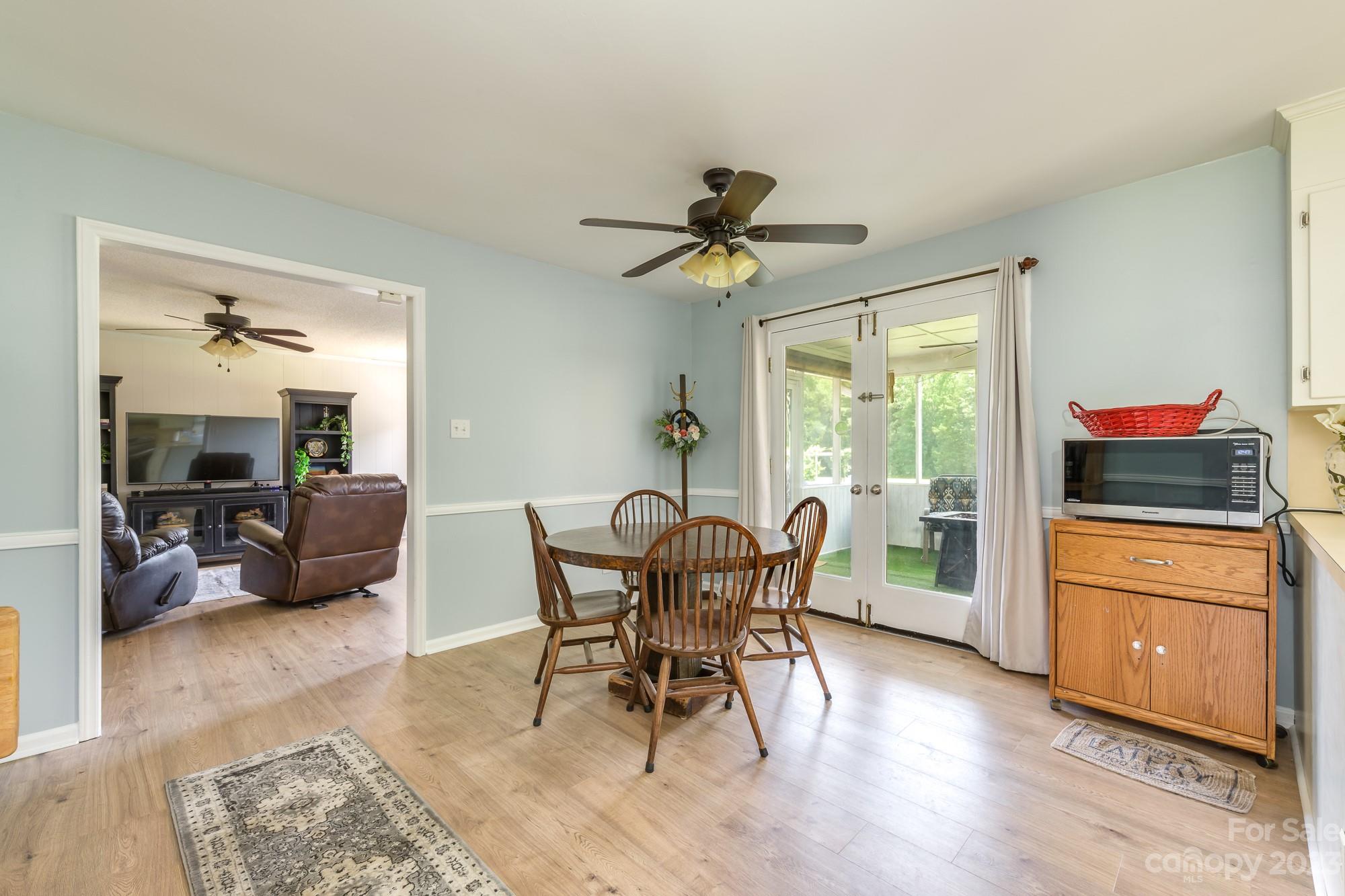 244 Pennington Road Rock Hill, SC 29732 - Photo 15 of 20 a view of a dining room with furniture and a chandelier