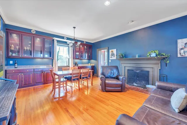 a living room filled with furniture and windows