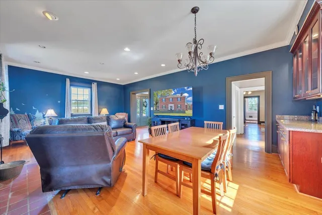 a view of a hallway with window and wooden floor