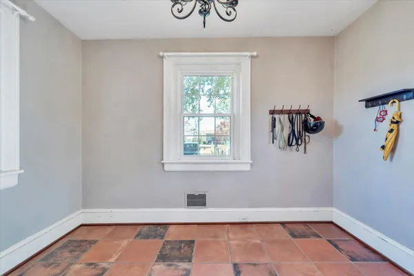 a view of walk in closet with clothes