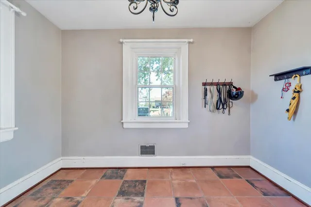 a view of walk in closet with clothes
