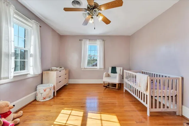 a view of a house with a yard fire pit and outdoor seating