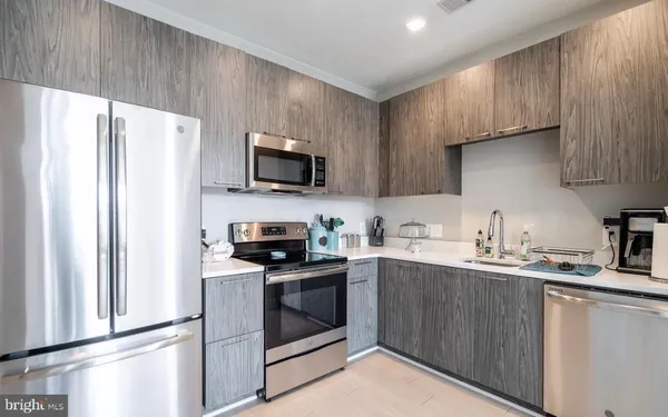 a kitchen with cabinets and window