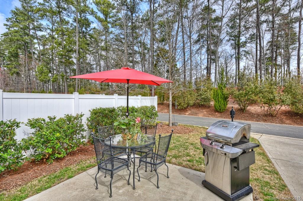 3446 Richard's Crossing Fort Mill, SC 29708 - Photo 14 of 15 a patio with a table and chairs under an umbrella