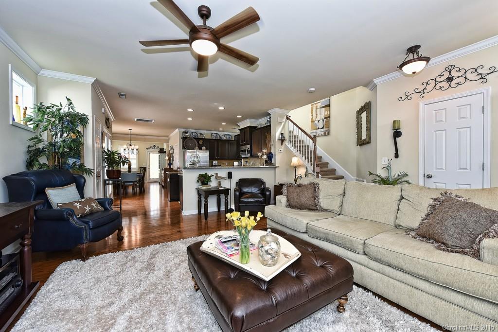 3446 Richard's Crossing Fort Mill, SC 29708 - Photo 3 of 15 a living room with furniture kitchen view and a chandelier