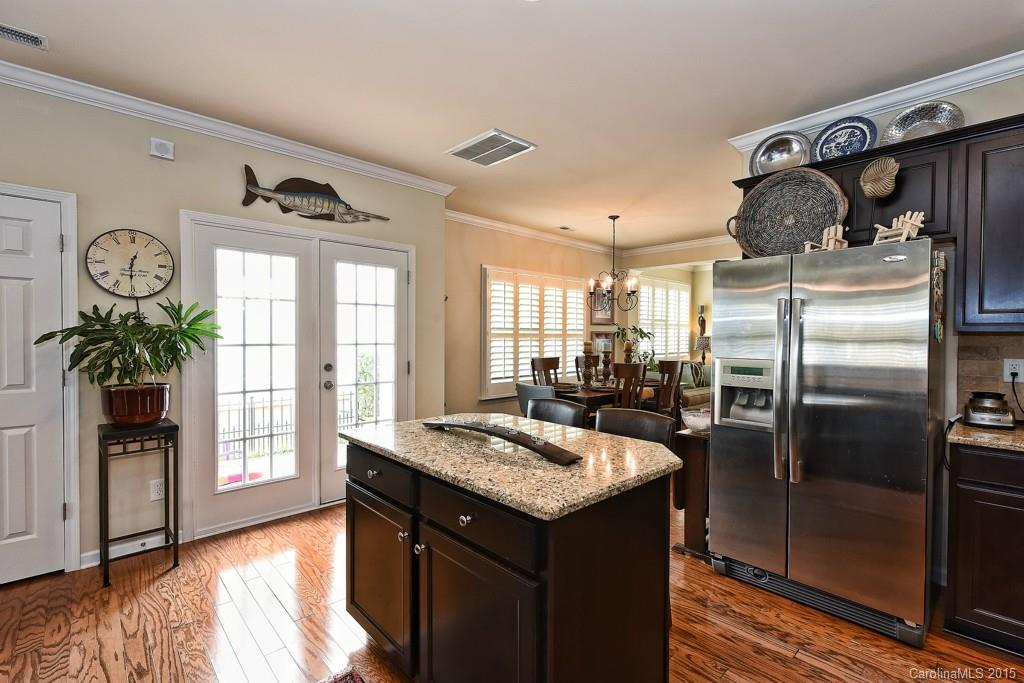 3446 Richard's Crossing Fort Mill, SC 29708 - Photo 6 of 15 a kitchen with granite countertop a refrigerator a stove and a sink