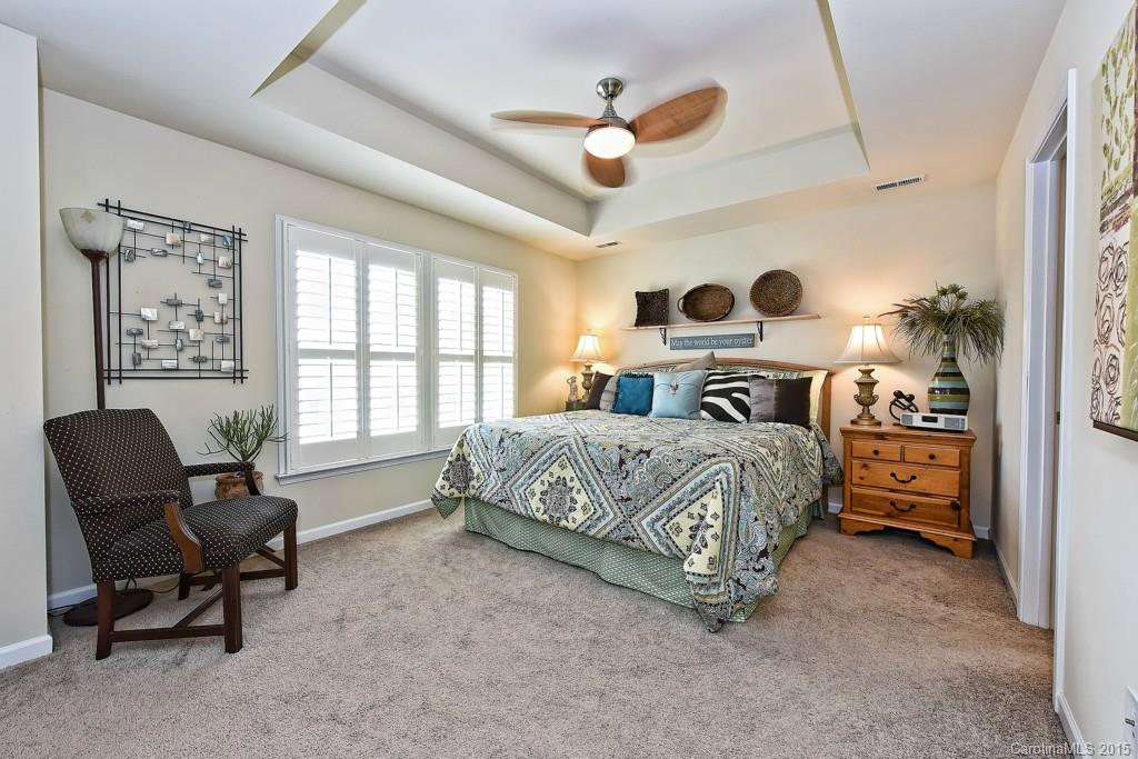 3446 Richard's Crossing Fort Mill, SC 29708 - Photo 10 of 15 a bedroom with a bed a chair and a large window