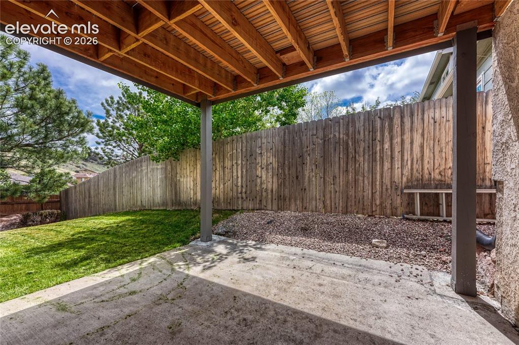 7285 Julynn Road Colorado Springs, CO 80919 - Photo 40 of 45 a view of a backyard with wooden fence