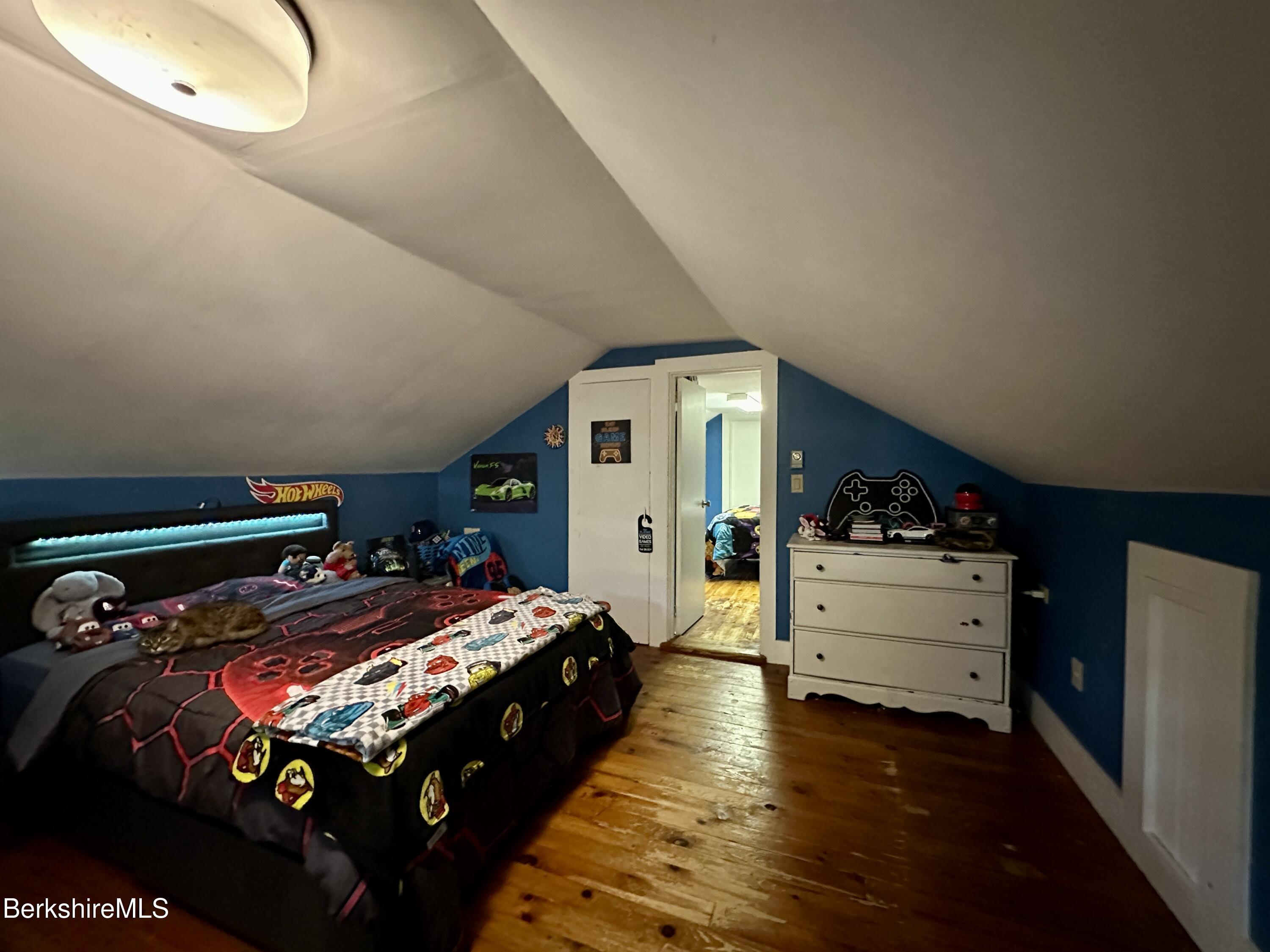 117 Norfolk Road New Marlborough, MA 01259 - Photo 14 of 16 a bedroom with bed and wooden floor