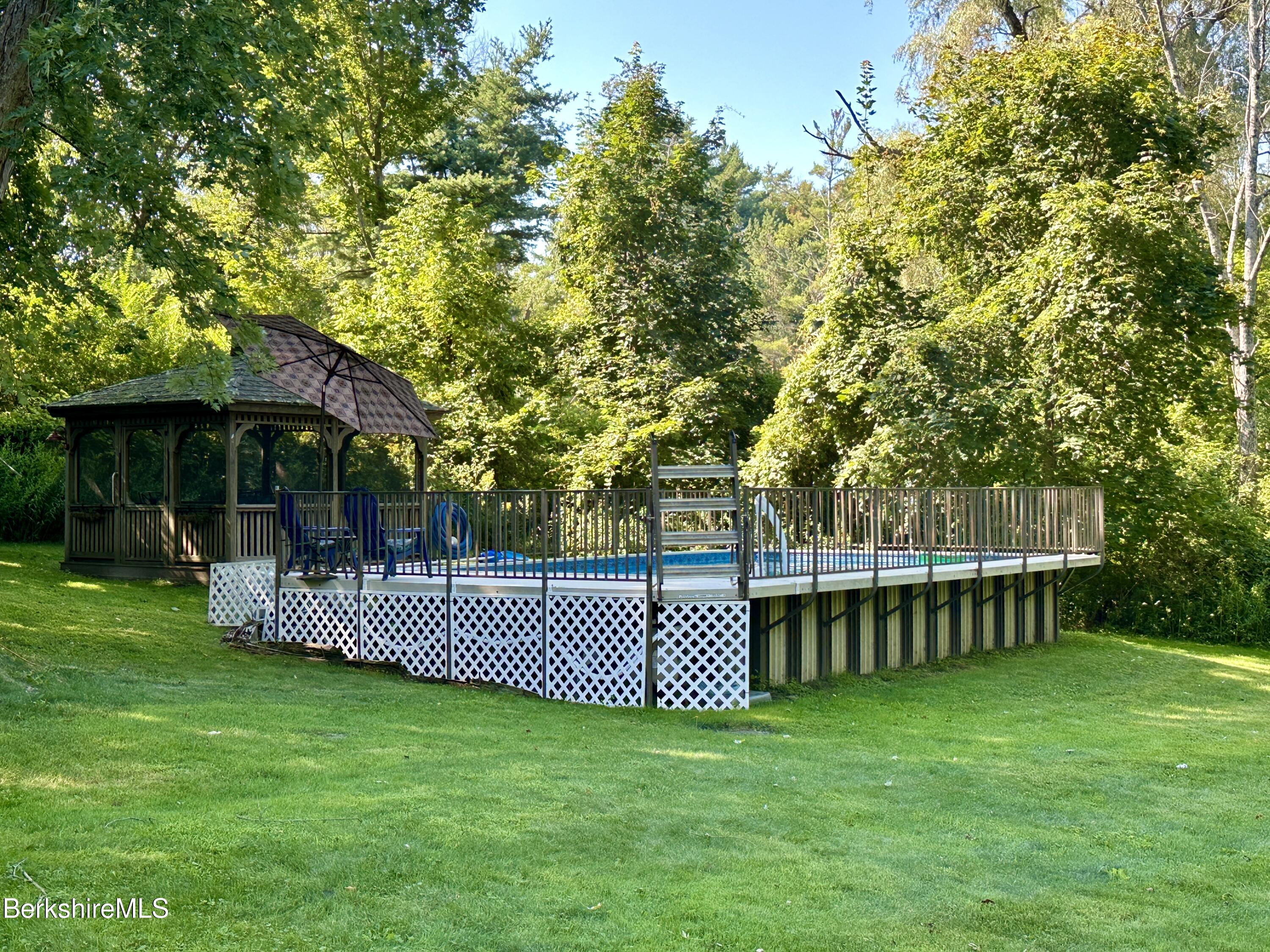 117 Norfolk Road New Marlborough, MA 01259 - Photo 4 of 16 a view of a patio with a garden