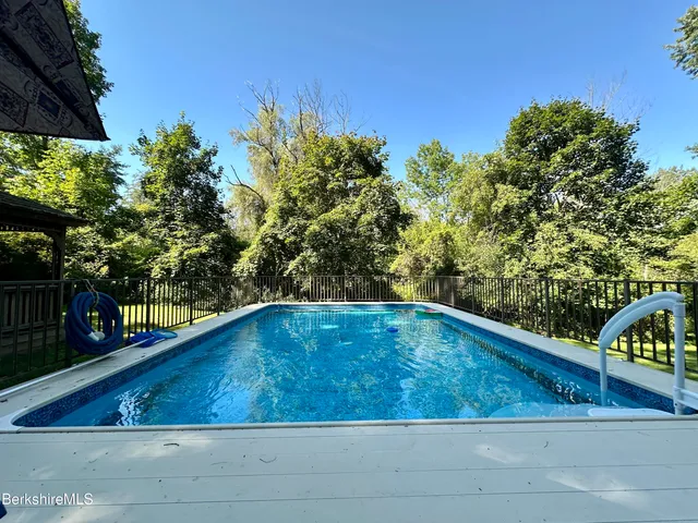 a view of swimming pool from a balcony