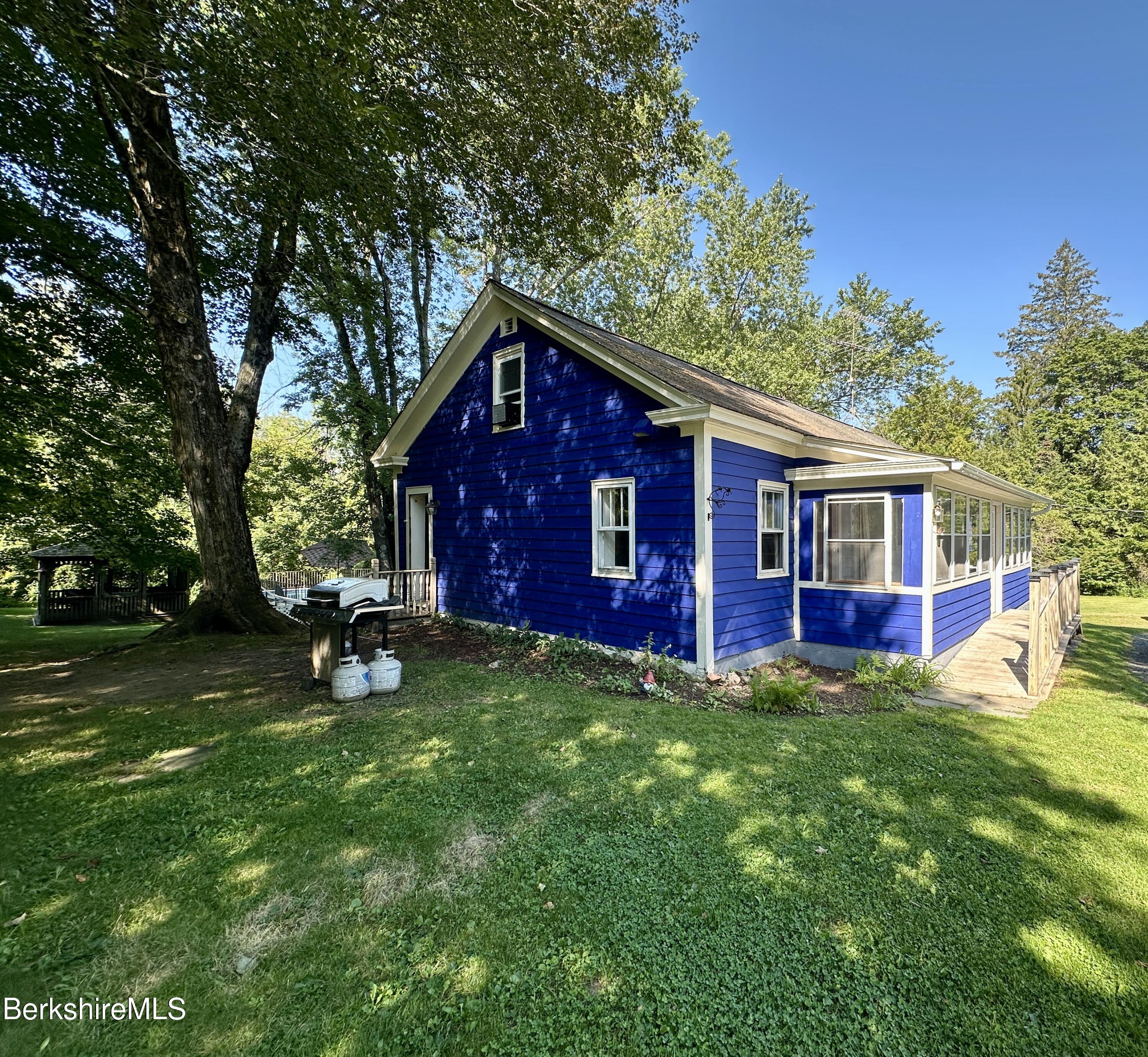 117 Norfolk Road New Marlborough, MA 01259 - Photo 6 of 16 a view of a house with a yard