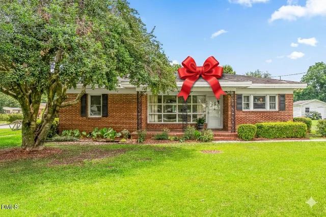 a house with garden in front of it