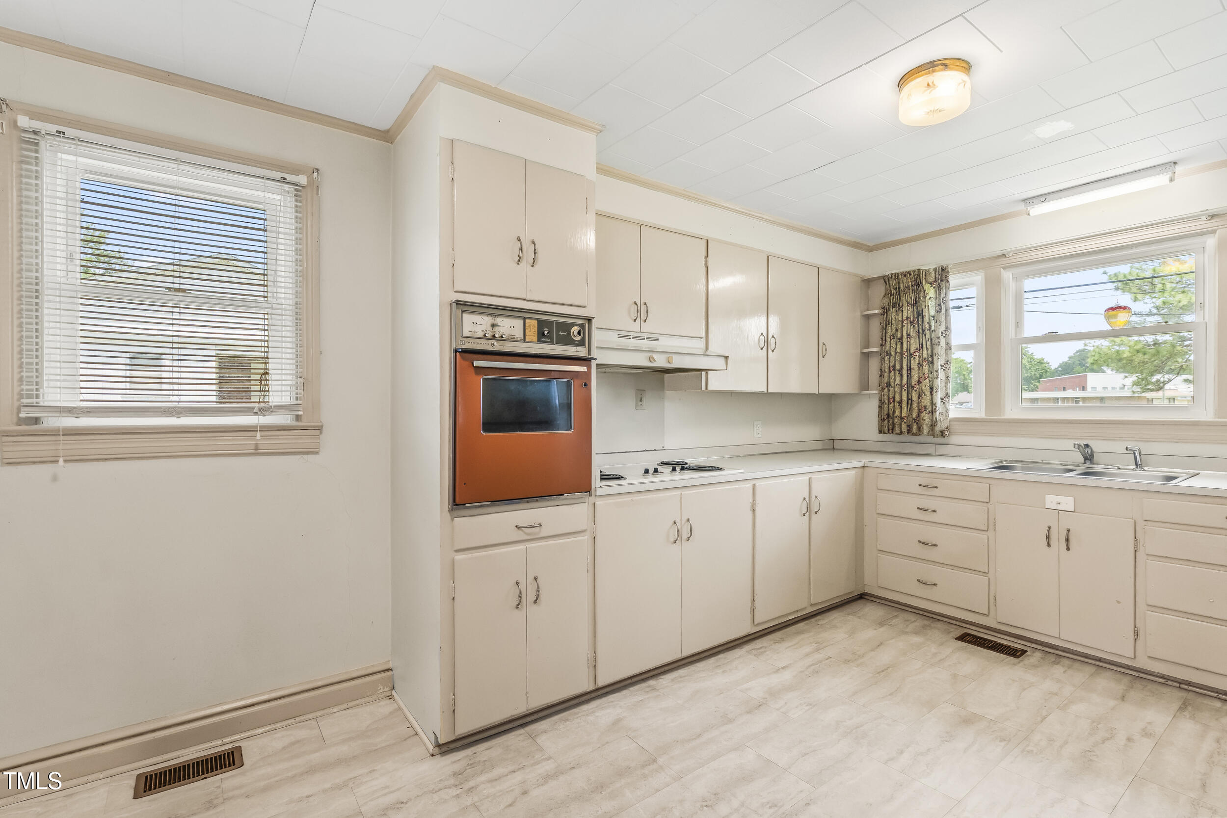 500 Rowan Road Clinton, NC 28328 - Photo 17 of 42 a kitchen with cabinets appliances and a window