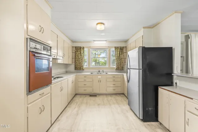 an aerial view of a houses with a lake view