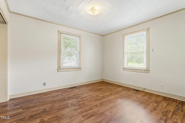 a kitchen with granite countertop cabinets and refrigerator