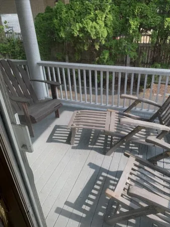 a view of balcony with wooden floor