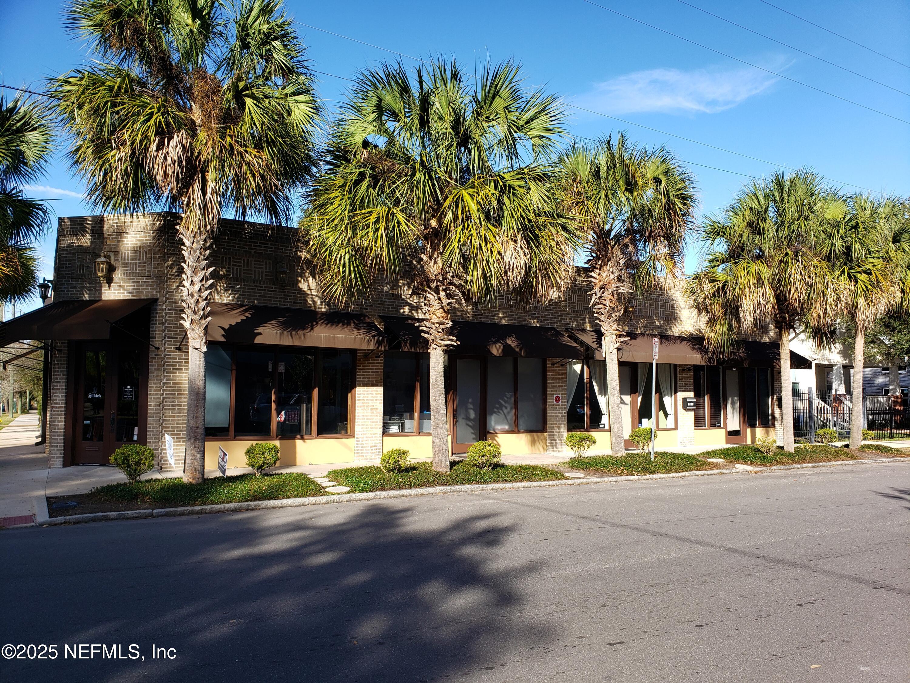a view of a street with houses on both side