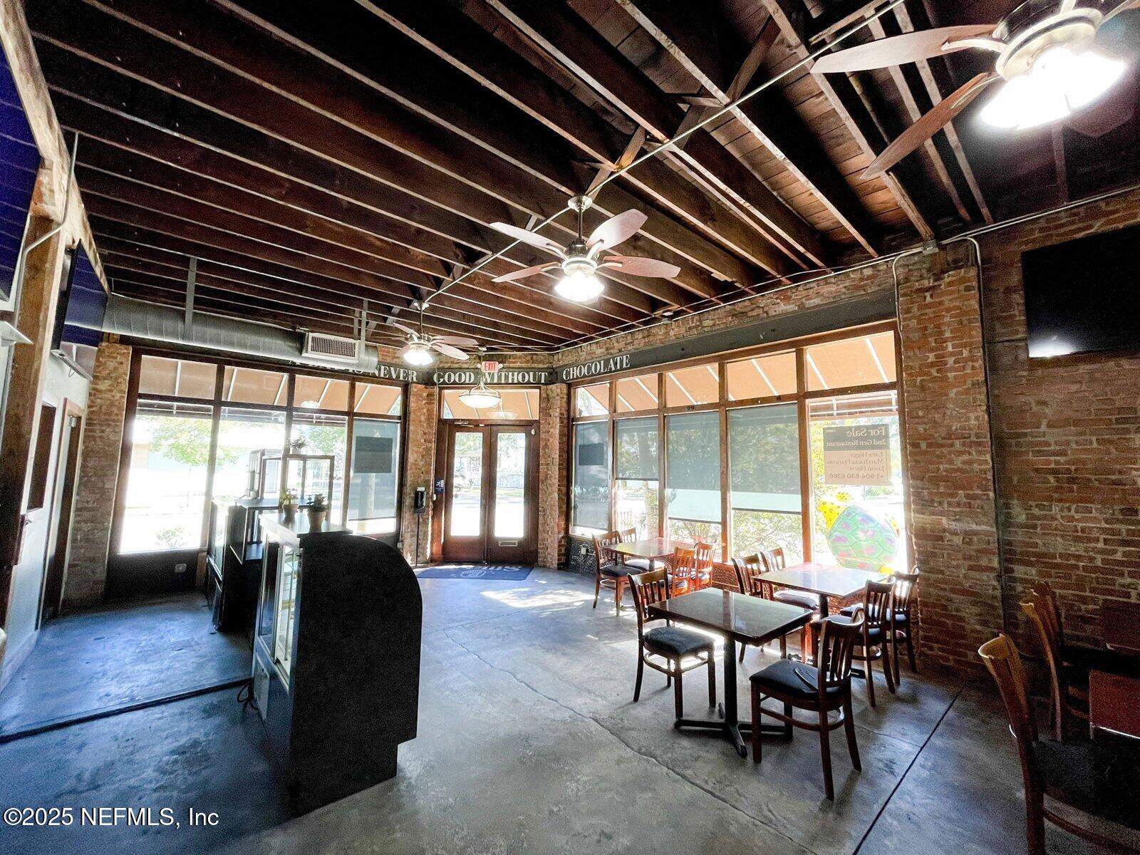 1602 Walnut Street Jacksonville, FL 32206 - Photo 3 of 10 a view of a dining room with furniture window and outside view