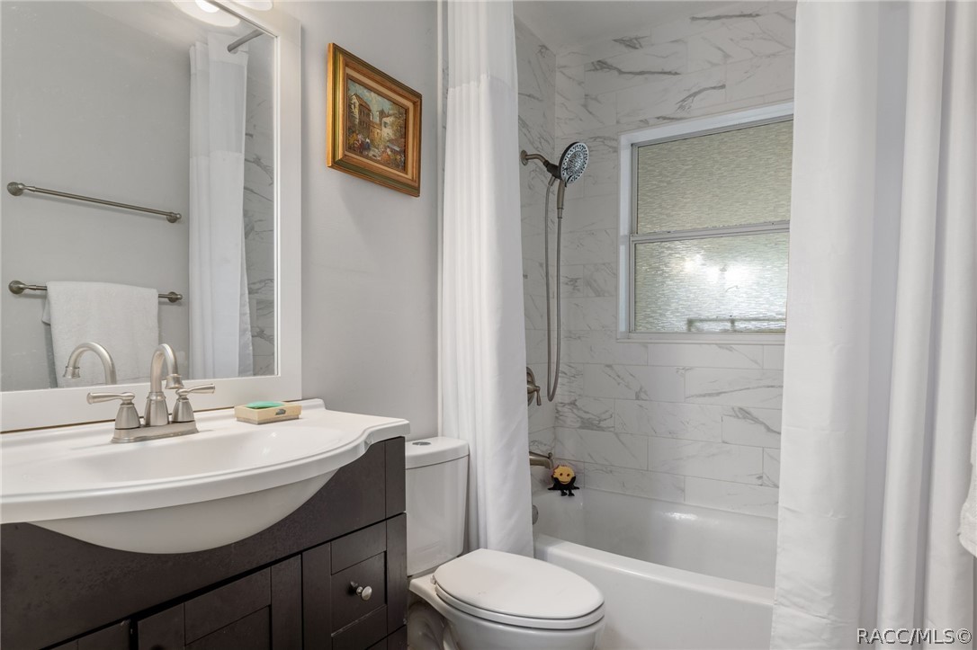 1140 South Highlands Avenue Inverness, FL 34452 - Photo 30 of 54 a bathroom with a sink toilet and shower