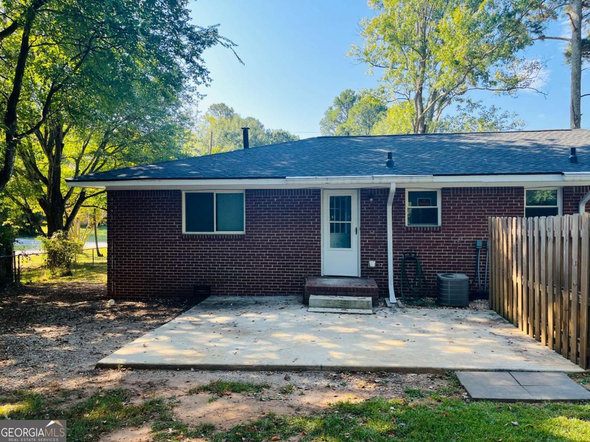 1076 Center Street Southwest, Unit 1074 Mableton, GA 30126 - Photo 25 of 26 a view of a house with a yard