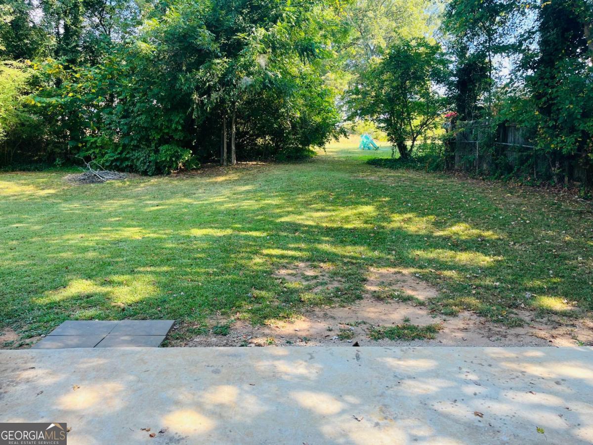 1076 Center Street Southwest, Unit 1074 Mableton, GA 30126 - Photo 26 of 26 a view of a trees with a big yard
