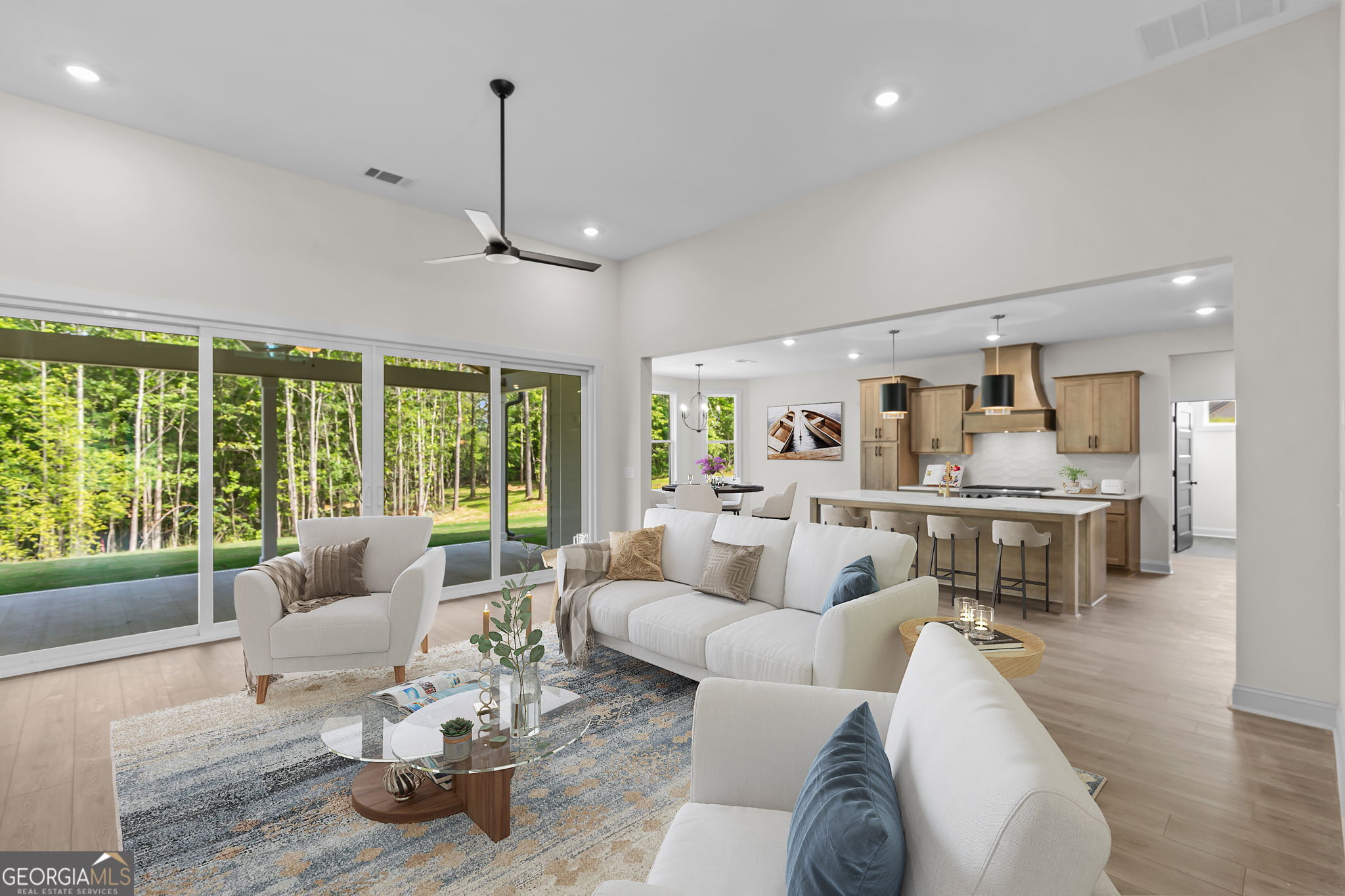 1593 Bethesda Church Road Carrollton, GA 30117 - Photo 13 of 50 a living room with furniture a dining table and a large window