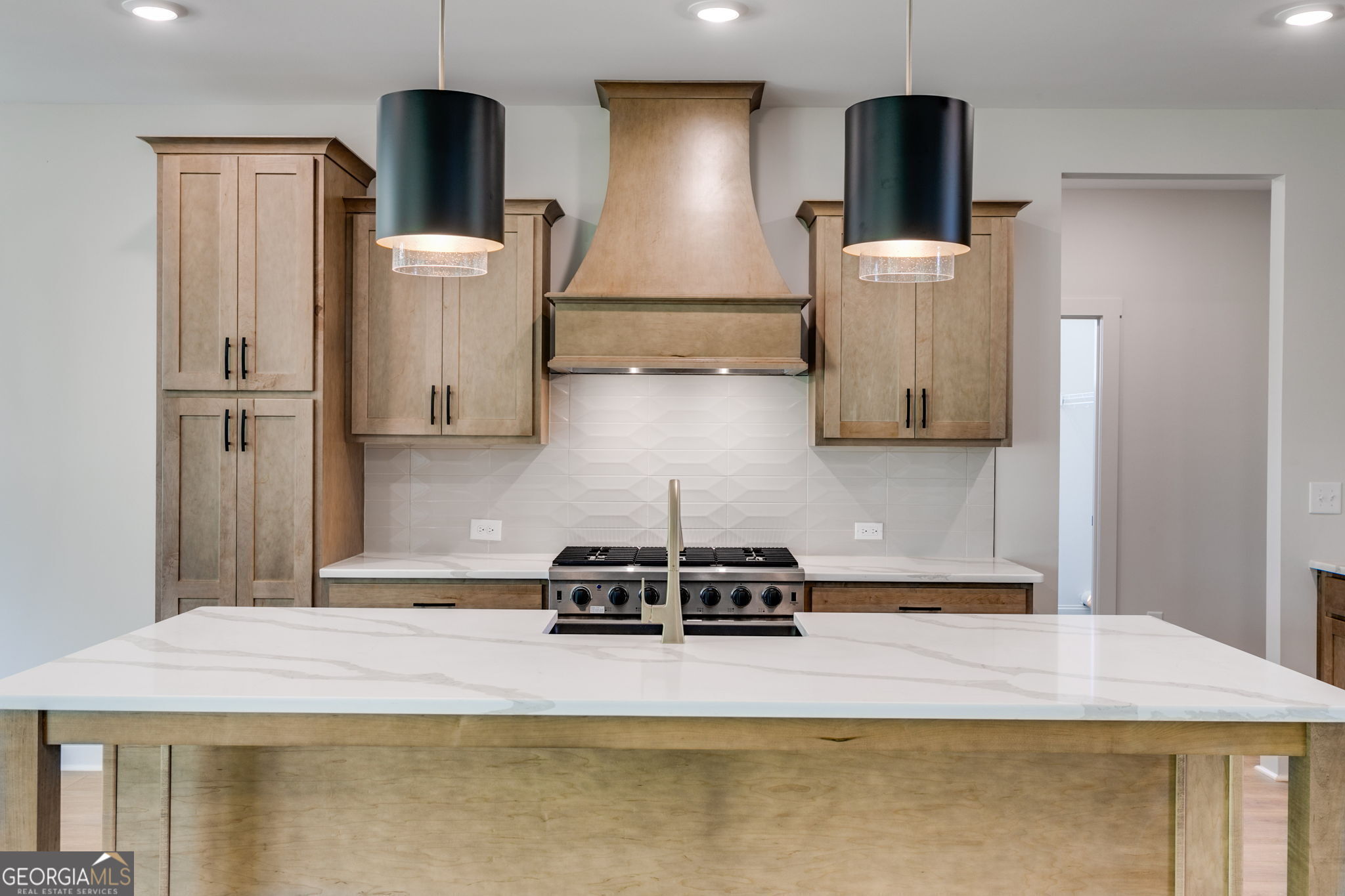 1593 Bethesda Church Road Carrollton, GA 30117 - Photo 17 of 50 a kitchen with a refrigerator a stove and a wooden floor